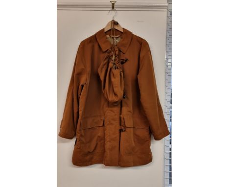 Burberrys:&nbsp;a light brown 3/4 length overcoat, with detachable hood.