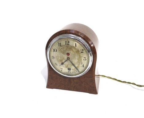 An E.A.C. Self Starting clock in a bakelite case, silvered Arabic numeral dial with date aperture,