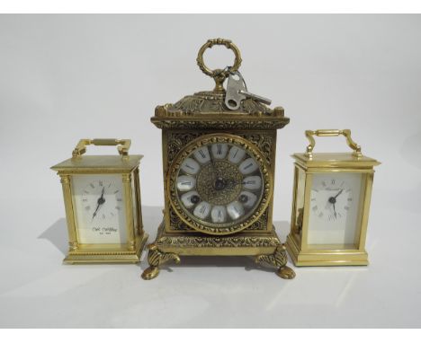 A small 21st Century ornate brass mantel clock. movement signed Franz Hermle (R for 2005), striking two bells, together with 