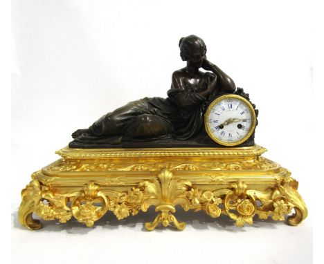 A 19th Century French bronze and ormolu/gilt metal mantel clock by Raingo Freres of Paris, the acanthus and floral ornate orm