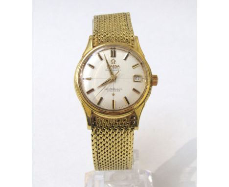 OMEGA: An 18ct gold cased Omega Constellation Calendar Automatic Chronometer wristwatch on an 18ct gold strap, silvered dial 