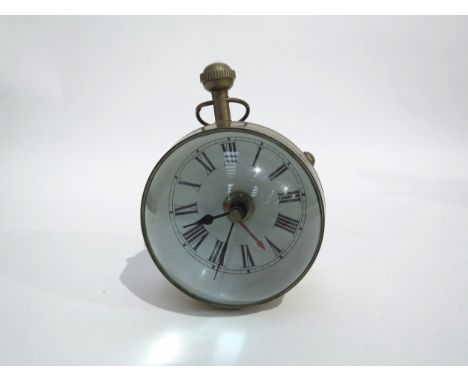 A large "Eye of Time" magnifying desk clock, the Roman numeral dial with centre seconds, reverse with compass face, both side