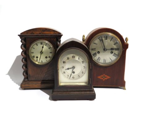 A group of wood cased mantel clocks, each with silvered dials, one movement signed Astral and another Junghans (3)