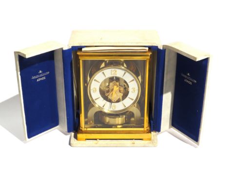 A Jaeger-LeCoultre brass cased Atmos mantel clock, the white chapter ring with Arabic numerals and arrow markers with arrow f