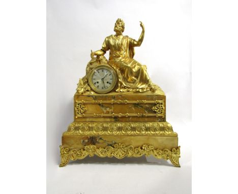 A large 19th Century ormolu/gilt metal and Siena marble mantel clock, the ornate layered base surmounted by an august looking