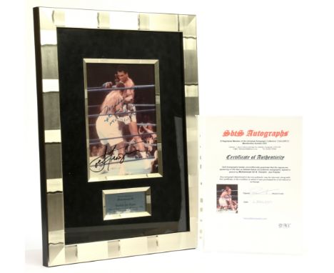 Muhammed Ali and "Smokin" Joe Frazier autographs, on a photograph print of Muhammed Ali vs Joe Frazier at Madison Square Gard
