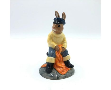 Bunny dressed as a fisherman Captain. Hand painted blue hat and trousers, light yellow sweater and black wellingtons. Artist: