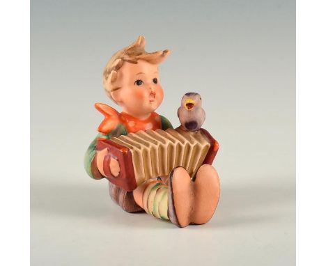 Figure of a boy with an accordion and a purple bird. Base marked model number 110/0, dated 1938. W. Goebel backstamp.&nbsp; A