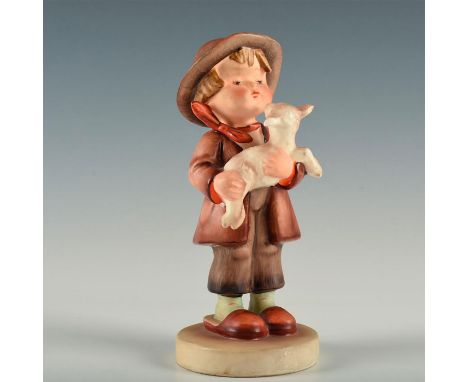 Figure of a boy holding a small sheep. Model number 68. Goebel&nbsp;backstamp. Artist: Arthur Moeller Issued: 1937 Dimensions