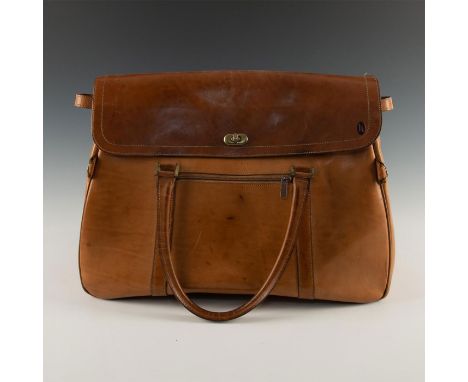 Exquisite tan leather, suede interior, straps, snaps, zippers. A vintage Hartmann tan brown weekend leather travel bag, with 