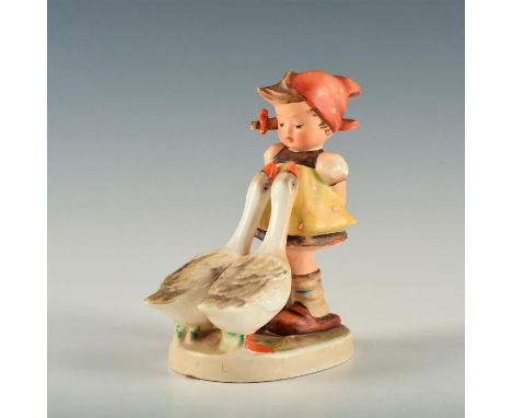 Figure of a girl with two geese.&nbsp; Base marked model number 47. M.I. Hummel inscribed to top of base. Goebel backstamp. A