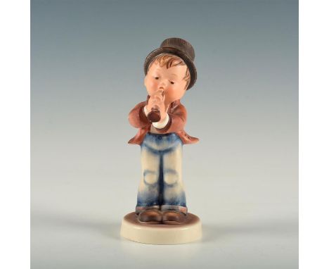 Figure of boy with dark gray hat playing the flute. Base marked model number 85. M.I. Hummel inscribed to top of base. Goebel