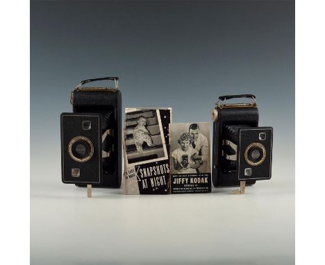 Stylish pair of the Kodak Six-20 and Six-16 versions with manual. Issued: 1930's Dimensions: 5"L X 3.75"D X 8"H largest, open