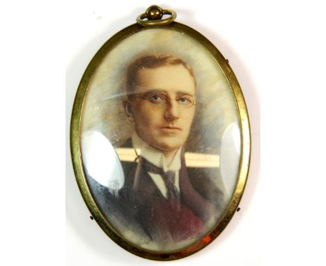 An early 20th century hand painted portrait of a young gentleman.