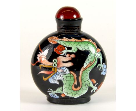 A Chinese enamel blue glass snuff bottle, H. 7cm.