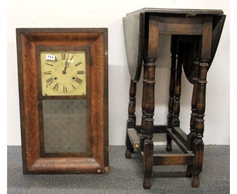 An American kipper box clock and an oak tea table.