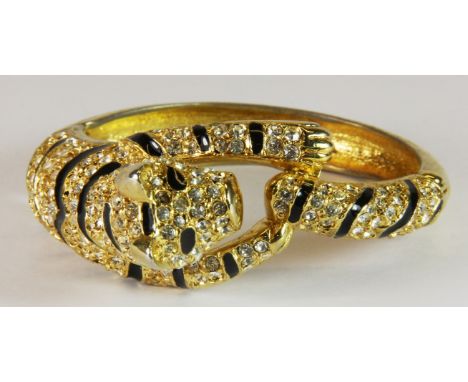 A Duchess of Windsor style gold plated tiger bangle.
