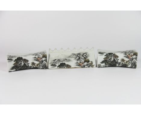 A Chinese mid 20th century hand painted porcelain brush rest decorated with winter scenes with a pair of wrist rest shaped sc