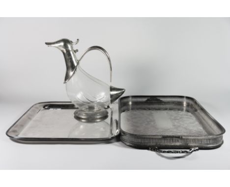 A silver plated gallery tray, a further silver plated tray and a silver plate and glass duck claret jug.