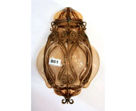 An interesting wrought copper and amber glass light fitting, H. 35cm.