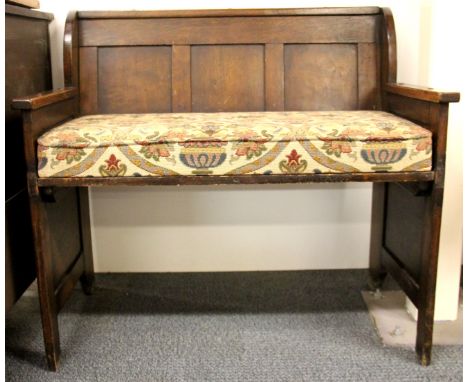 An oak bench style hall chair with purpose made cushion, W. 81cm, H. 76cm.