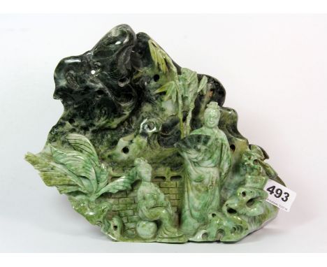 A mid 20th century Chinese carved jade pebble of figures in a landscape, H. 20cm, W. 26cm.