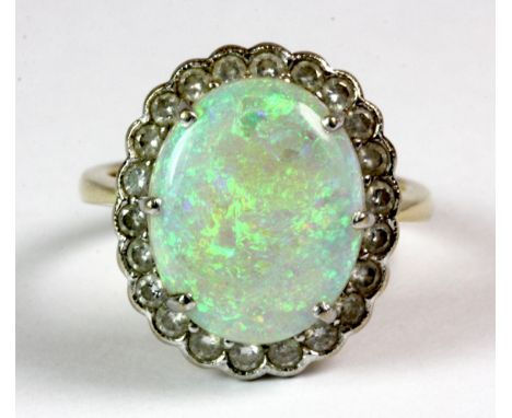 An 18ct gold opal and diamond cluster ring, (N.5)