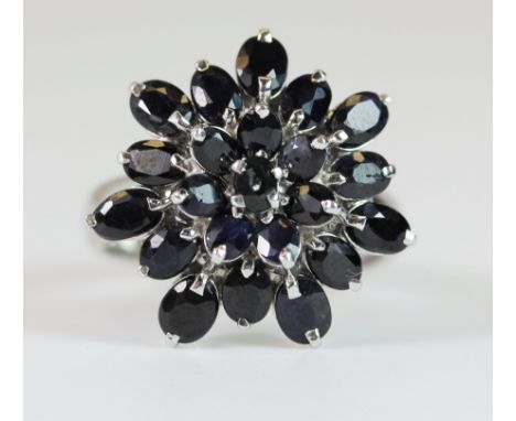 A large 925 silver sapphire cluster ring, (Q).