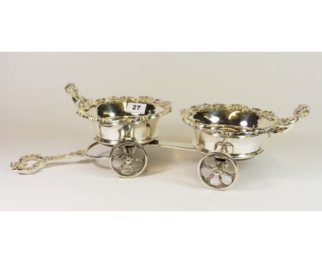 An unusual double silver plated wine bottle coaster, L. 54cm.