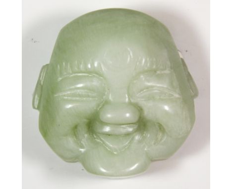 A Chinese carved nephrite jade buckle, H. 5.5cm.