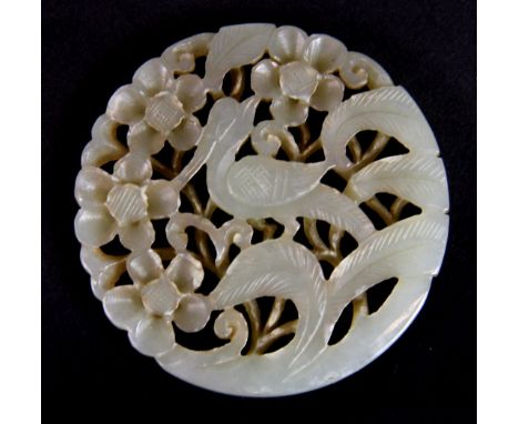 A small circular Chinese carved jade panel probably from the top of a box, Dia. 5.5cm.