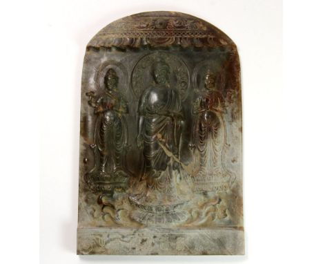 A very fine Chinese carved jade temple panel of a standing Buddha flanked by two Bodhisattva, H. 16.3cm, W. 11cm.