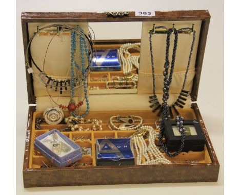 A jewellery box and contents including silver.