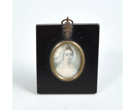 Portrait miniature of Eleanor Joseph Wright, painted in ivory oval panel, mounted in an ebonised frame with similarly mounted