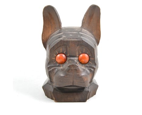 A German wooden mantel clock in the form of a dog, the time read by a marker on the two revolving eyes, keyless wind movement