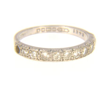 A diamond half eternity ring, ten brilliant cut diamonds (one end stone missing) claw set in an 18 carat white gold mount, pl