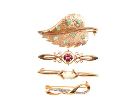 Four various brooches, a 9 carat yellow gold 50mm leaf claw set with seven emeralds, three modern bar brooches, one set with 