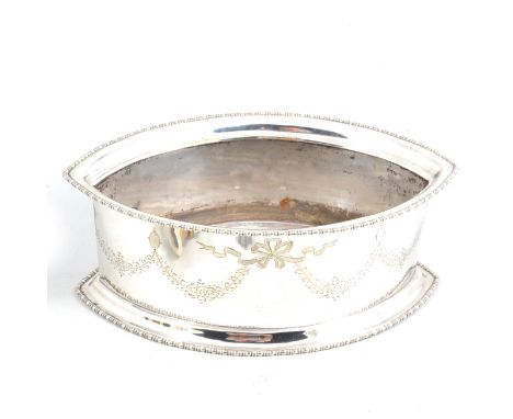 A silver-plated table flower trough in the Adam style, navette shaped with a beaded border to top and bottom, the body engrav