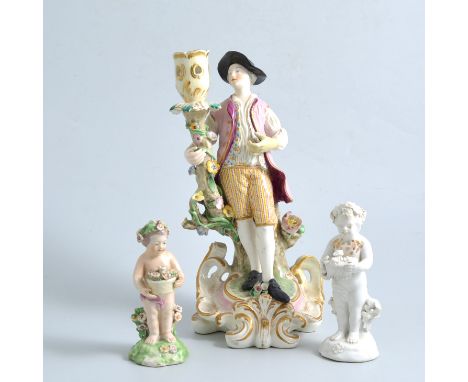 Derby Putti; another and a candlestick figure, (3)