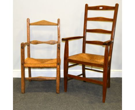 Beechwood ladder back elbow chair, rush seat, together with a country made elbow chair, rush seat (2)