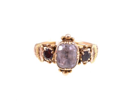 Two gemset rings, a diamond solitaire ring, the slightly oval old brilliant cut stone claw set in a single stone mount stampe