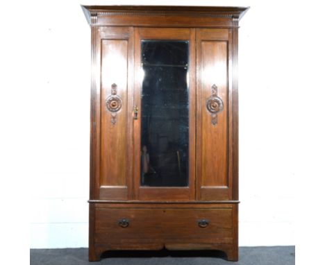 Oak wardrobe, moulded and dentil cornice, plain frieze, central mirror panel door, enclosing a hanging rail, drawer under, br