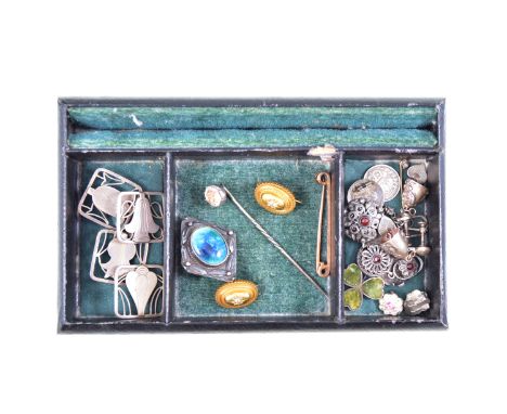 A vintage jewel box containing four 20mm square buttons, silver coloured stamped "Sterling" depicting stylised flowers with a