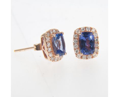 A pair of tanzanite and diamond rectangular cluster earstuds, the rectangular tanzanites 7mm x 5mm four claw set and surround