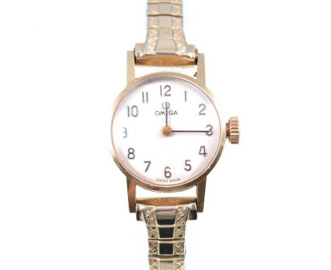 Omega - a ladies wrist watch, the white arabic numeral dial in a 9 carat yellow gold case number 5115002, hallmarked London 1