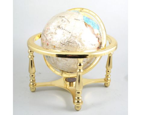 An ornamental gemstone globe, a 330m diameter handcrafted globe with blue background and semi-precious stones depicting the c