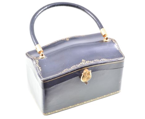 A vintage navy box shaped bag with gold tooling, "JemCo" brown ruched bag with mirror and purse, a black evening bag with cel
