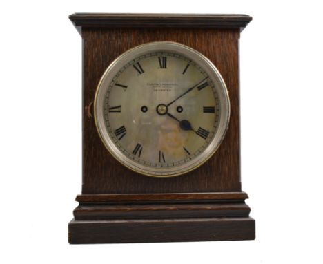 Edwardian oak mantel clock, circular silver dial, signed Curtis & Horspool, Leicester, 32cm; and a small mahogany domed top m