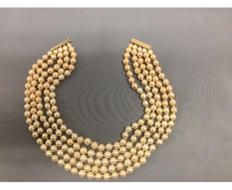Five row cultured pearl necklace to a 9ct gold clasp, the pearls of approx. 6-7.5mm dia., 32.5cm shortest row PLEASE always c
