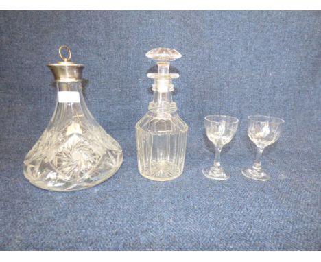 A silver mounted cut glass decanter, a further decanter & 2 sherry glasses PLEASE always check condition PRIOR to bidding or 